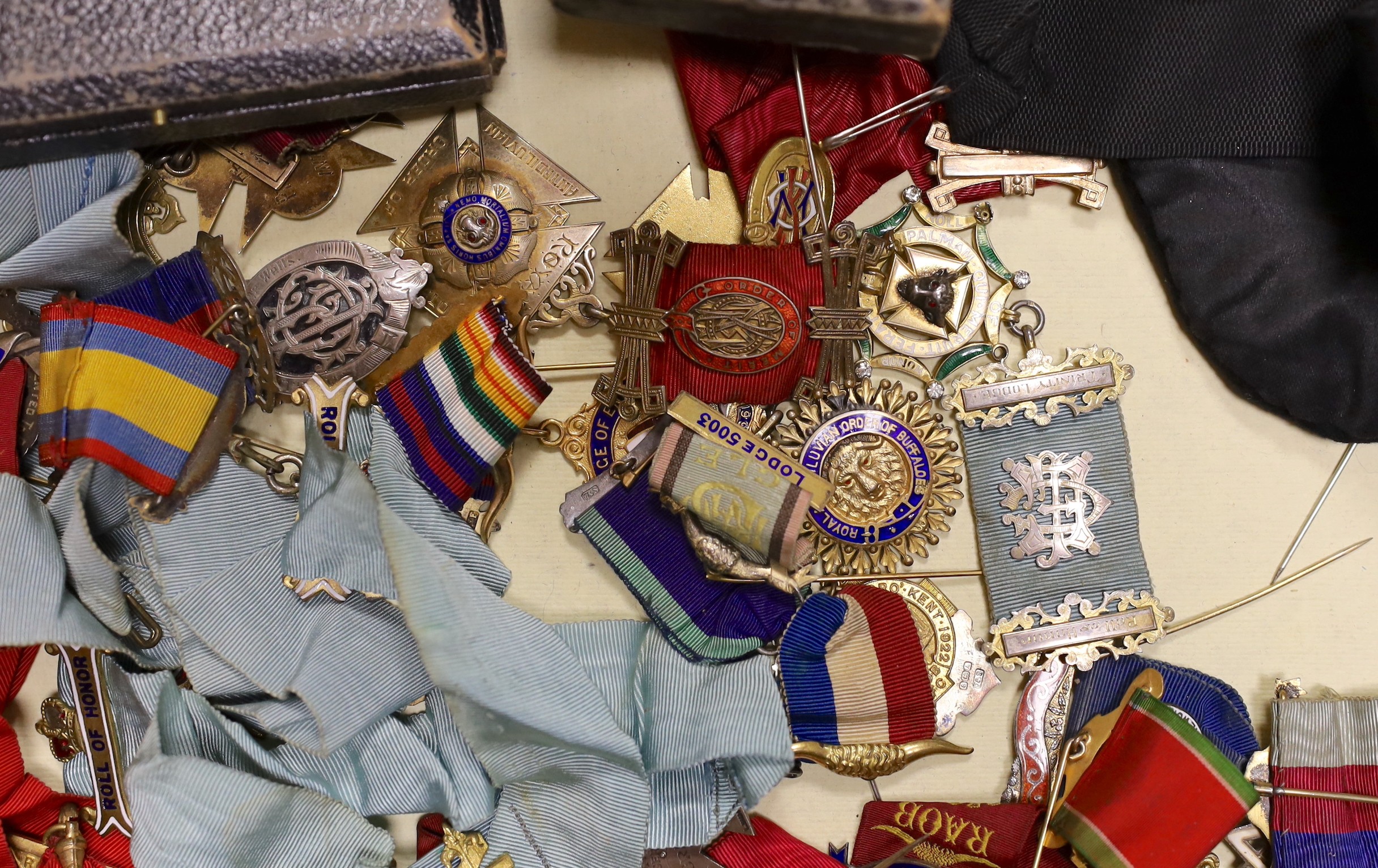 A collection of Kent, local Masonic lodge medals/accessories;, twenty two silver jewels, eleven other medals/jewels and five aprons and associated sashes